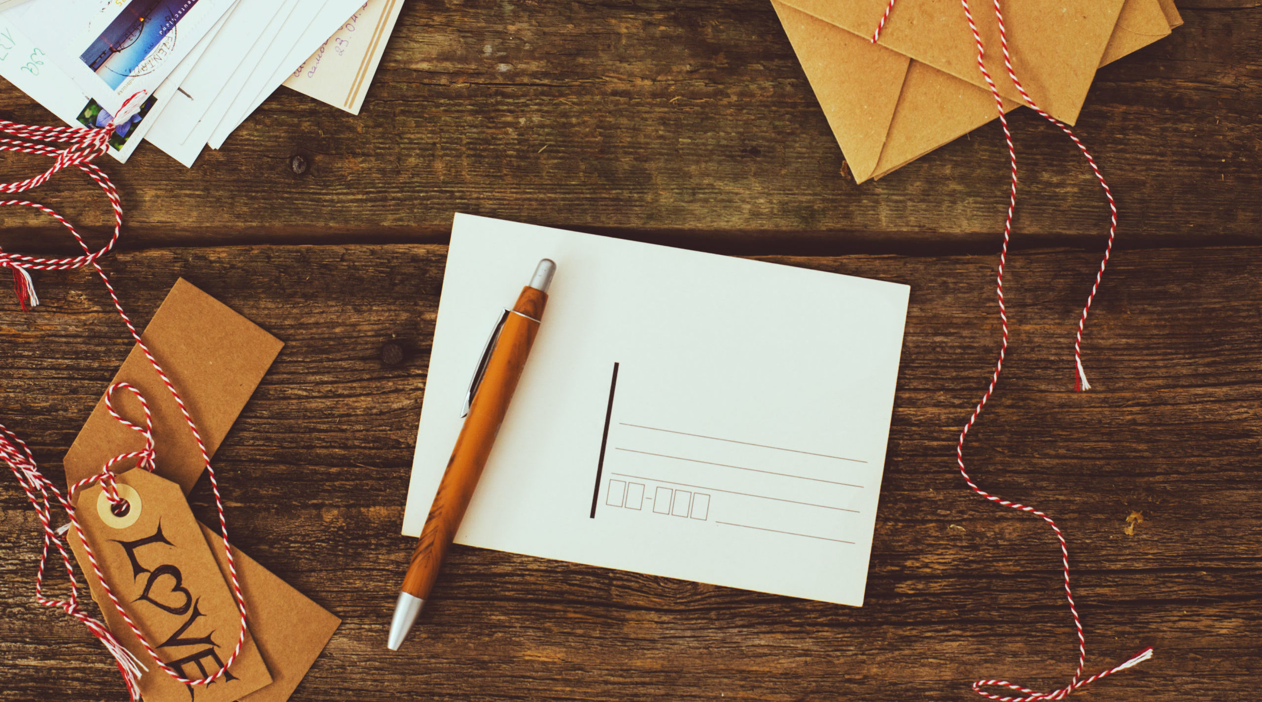 Freepik Mail on the wooden table